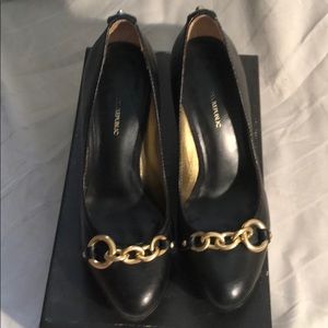 Banana republic black with gold metal ring pumps.